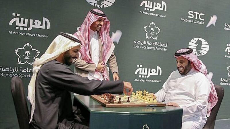 In this Monday, Dec. 25, 2017 photo released by Saudi Press Agency, two Saudi officials play chess during the opening the first ever chess tournament in Riyadh. Saudi Arabia is hosting a world chess tournament for the first time on Tuesday nearly two years after the country&#39;s top cleric issued a religious edict against playing the board game. (Saudi Press Agency via AP). 
