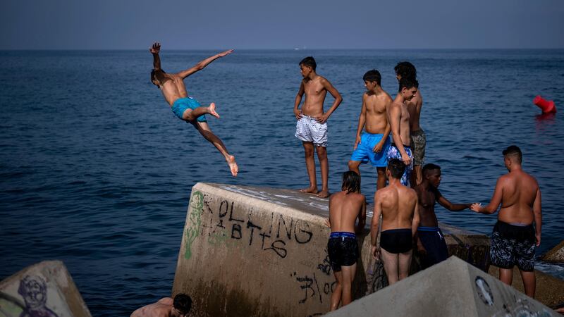 Spain sweltered in an unrelenting heatwave on Wednesday as temperatures started to build towards what is forecast to be a torrid weekend across southern Europe (Emilio Morenatti/AP)