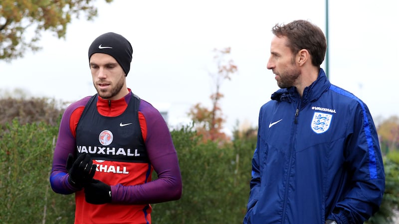 Interim England manager Gareth Southgate with stand-in captain Jordan Henderson during a training session at Tottenham Hotspur Training Centre on Monday<br />Picture by PA