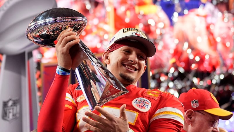 Kansas City Chiefs quarterback Patrick Mahomes celebrates with the Super Bowl trophy