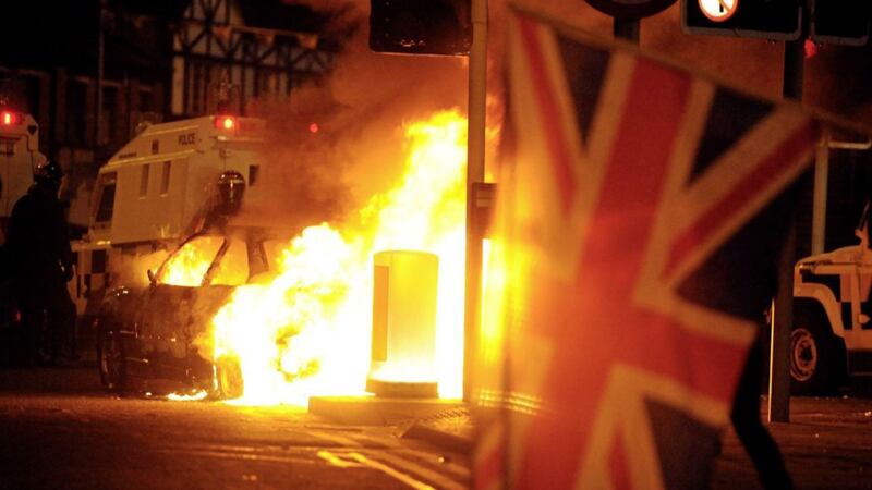 A burning car in east Belfast in January 2013 after police tried to separate loyalist and nationalists as protesters returned from a flag protest at city hall 