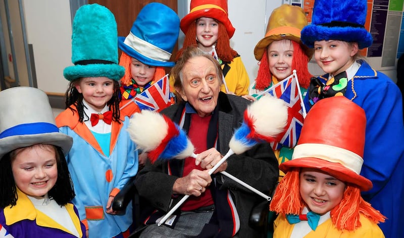 Sir Ken Dodd, surrounded by Diddy Men, leaving hospital (Peter Byrne/PA)