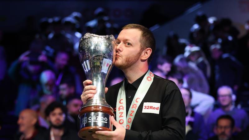 Mark Allen kisses the trophy after last year's UK Championship win