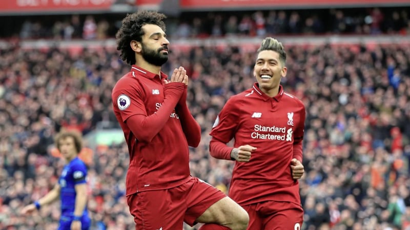 Liverpool&#39;s Mohamed Salah (left) celebrates his goal against Chelsea on Sunday. 