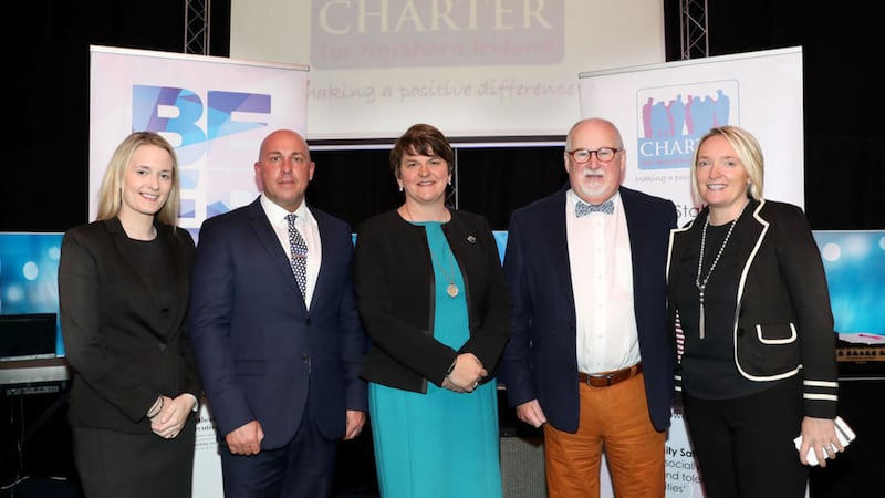 First Minister Arlene Foster (centre) with DUP councillor Sharon Skillen, loyalist Dee Stitt, Charter NI chairperson Drew Haire and project manager Caroline Birch 