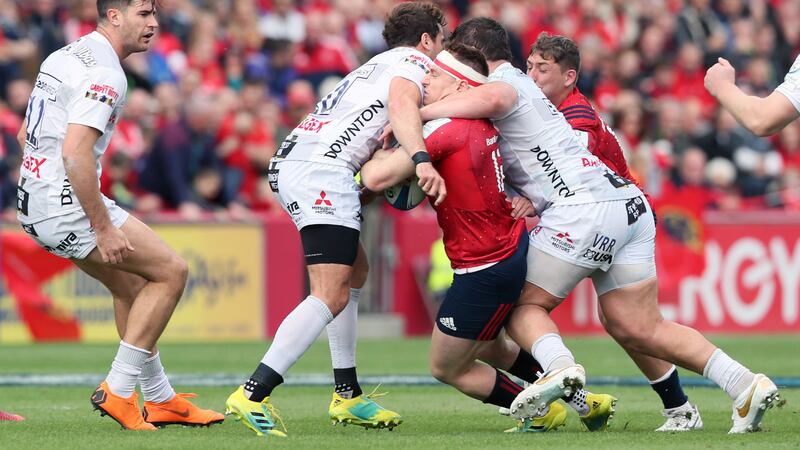 Gloucester's Danny Cipriani (left) tackles Munster's Rory Scannell (centre), resulting in a red card during the Heineken European Champions Cup match at Thomond Park, Limerick.  <br />&nbsp;