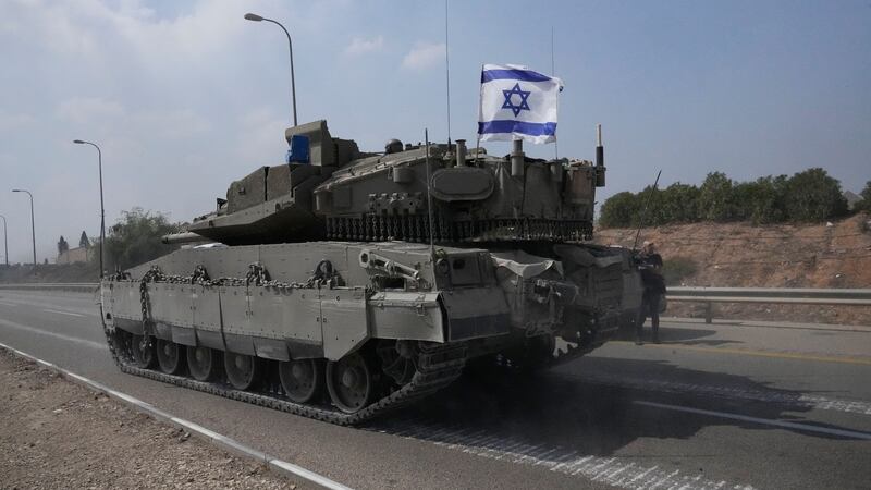 An Israeli tank heads south near Sderot (Ohad Zwigenberg/AP/PA)