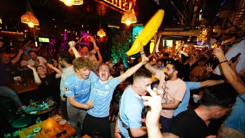 Man City fans celebrate their first goal (PA)