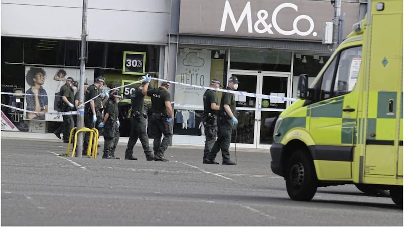 Police at the scene at Laharna Retail Park in Larne where a man in his 40s was attacked on Monday evening. Picture by Hugh Russell 