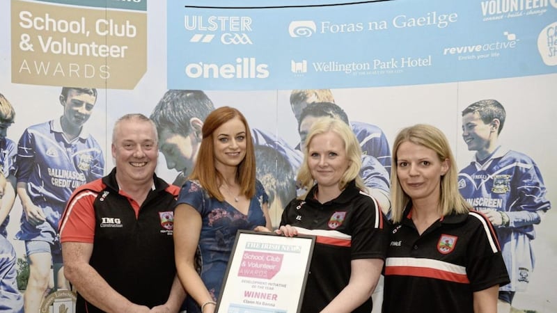  Barney Campbell, Emma Loughran and Fran McElvoy of Clann na Banna are presented the award for Best Development Initiative at the Irish News School, Club &amp; Volunteer Awards by Martina Madden of O&rsquo;Neills Sportswear. 