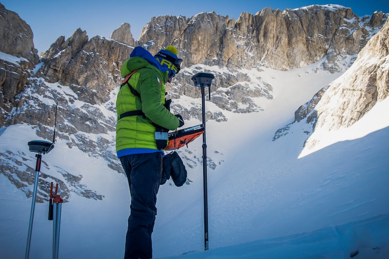 A scientist sets up sound equipment on the slopes of the Mt Gran Sasso d'Italia, in central Italy