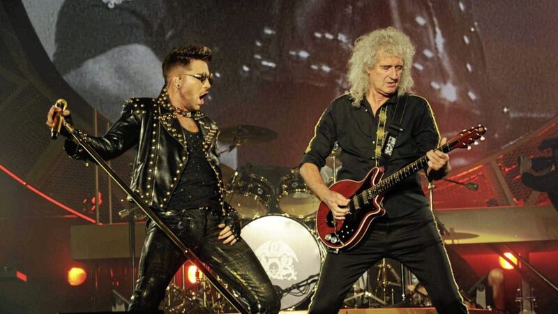 Current Queen frontman Adam Lambert and guitarist Brian May in action 