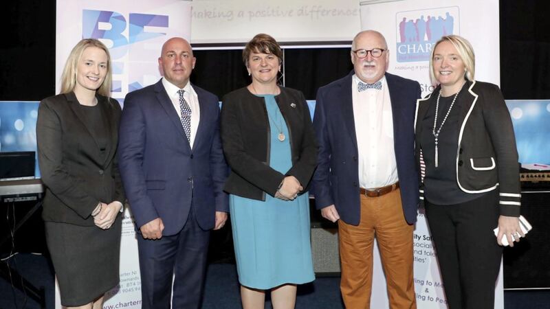 The awarding of funding to Charter NI. From left, DUP councillor Sharon Skillen, loyalist Dee Stitt, First Minister Arlene Foster, Charter NI chairman Drew Haire and project manager Caroline Birch 