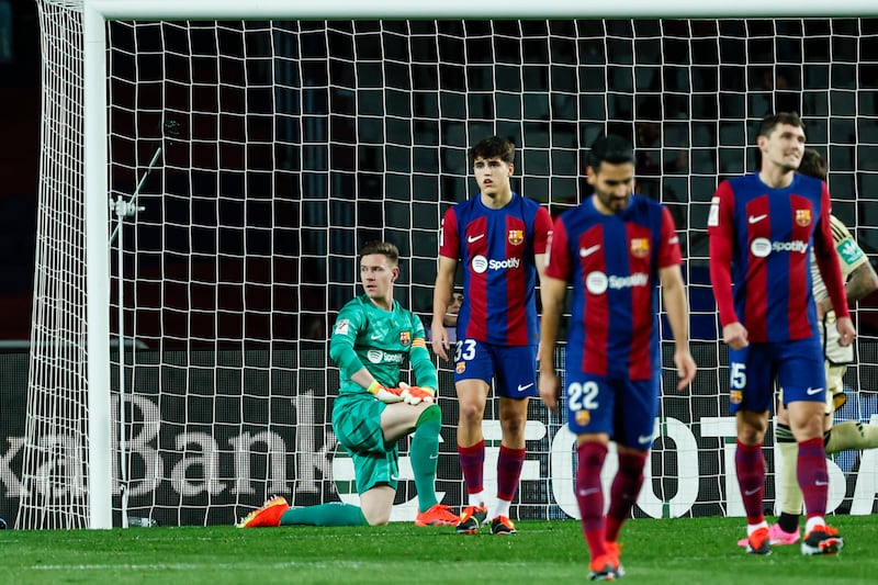 Barcelona are now 10 points behind Real Madrid after dropping points (Joan Monfort/AP)