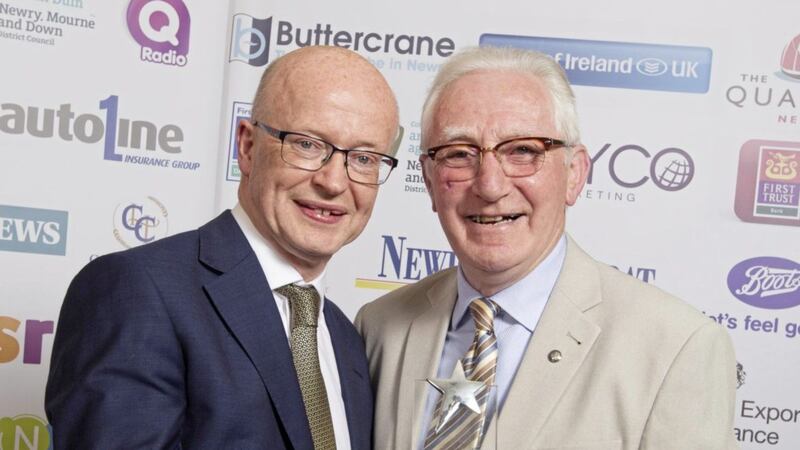 Jerome Mullen (right) receives his outstanding achievement award from Peter Murray representing sponsors Buttercrane Shopping Centre 