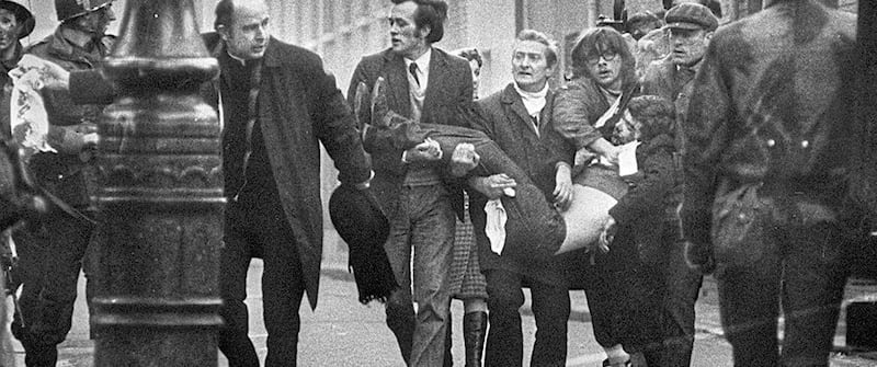 A photograph of Bishop Daly leading a group as they carried victim, Jackie Duddy from the Bogside became one of the iconic images of Bloody Sunday.  