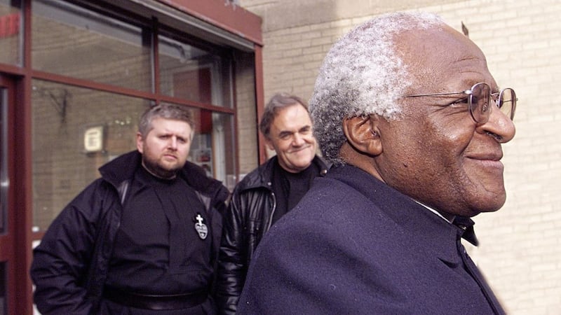 Archbishop Desmond Tutu, pictured with Fr Aidan Troy and Fr Gary Donegan, was among the international figures to support the pupils, parents and staff at Holy Cross Girls&#39; School. Picture by Ann McManus 