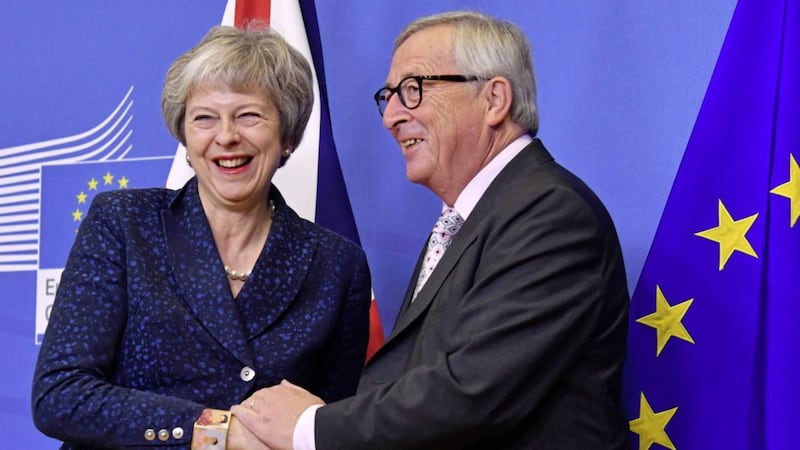 European Commission president Jean-Claude Juncker, right, greets British Prime Minister Theresa May at EU headquarters in Brussels. Picture by Geert Vanden Wijngaert, Associated Press 