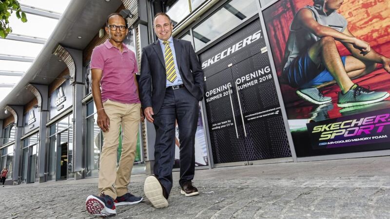 Sunil Shah, executive director of Shuz 4 U Group, pictured with Chris Nelmes, centre manager at The Boulevard at the launch of the Sketchers outlet 