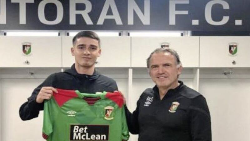 Jay Donnelly pictured with Glentoran FC manager Mick McDermott. Picture from Glentoran FC  