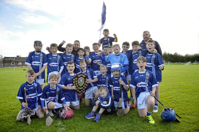 Proud coaches David Sheehan and Gareth Bellew celebrate with the St Galls U12 hurlers as they lifted the Nipper Quinn Shield at Rossa over the weekend. The Milltown boys overcame Davitt&#39;s and have won both the league and championship in 2018. Picture by Mark Marlow 