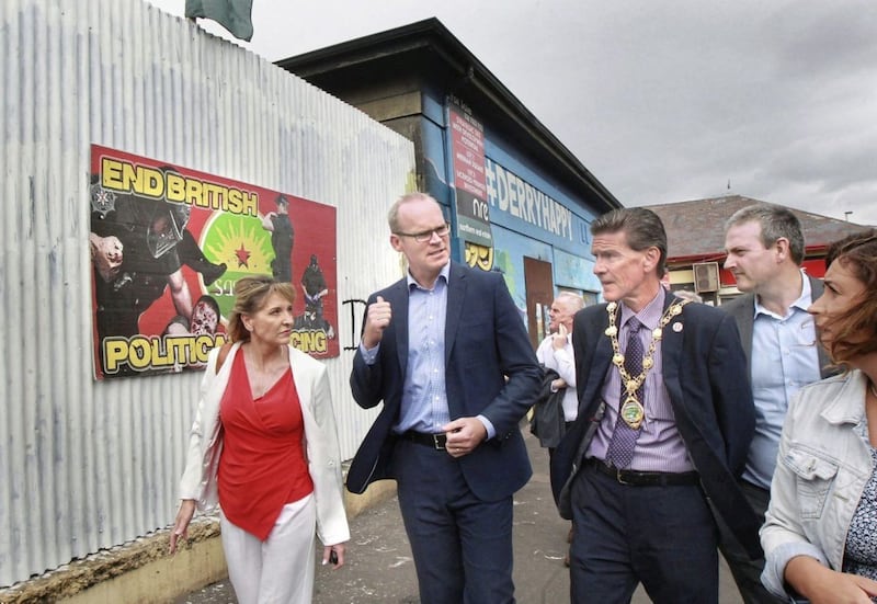 T&aacute;naiste Simon Coveney pictured with mayor John Boyle and Martina Anderson MEP in Derry's Bogside. Picture by Margaret McLaughlin