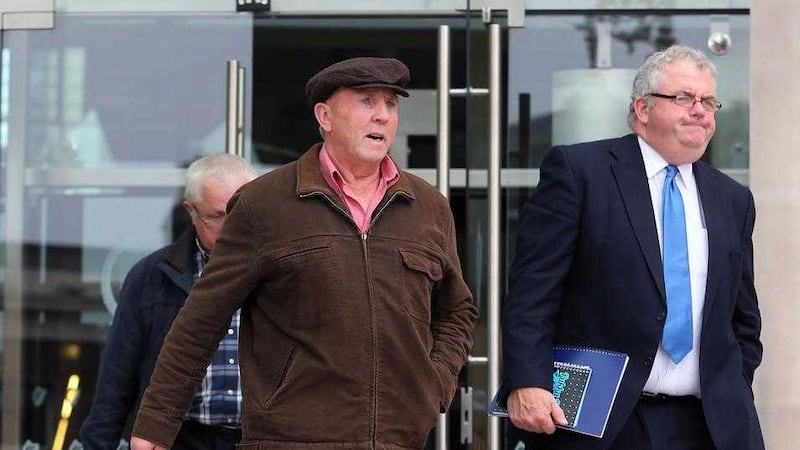 Thomas &quot;Slab&quot; Murphy (centre), who owns a farm in Co Louth straddling the border with Northern Ireland, leaves the non-jury Special Criminal Court in Dublin, where he pleaded not guilty to nine tax offences in the Republic. Picture by Niall Carson/PA Wire