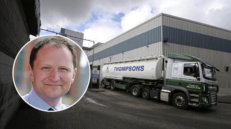 A lorry with Thompsons branding leaving the Thompsons feed mill in Belfast. An inset picture shows group owner William Barnett.