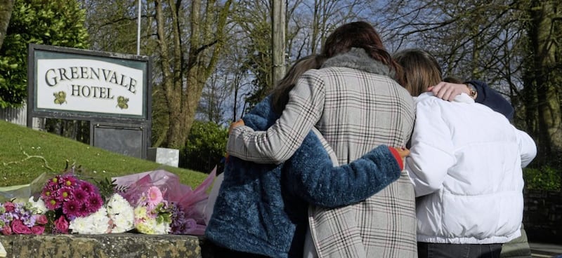 Friends comforted each other as they left flowers and tributes at the entrance to the Greenvale Hotel in Cookstown. Picture by Justin Kernoghan, Photopress Belfast