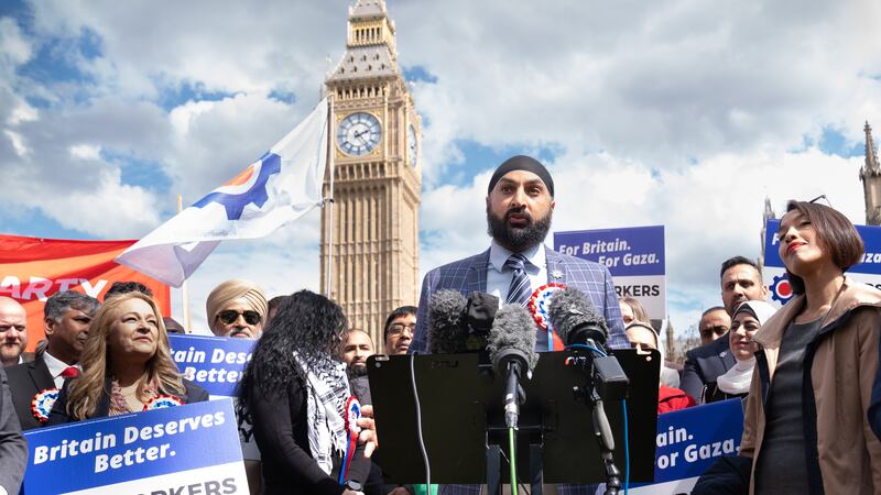 Monty Panesar attending a news conference with George Galloway