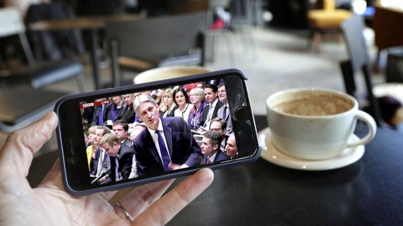 A smartphone shows the Chancellor Philip Hammond making his Budget statement to MPs in the House of Commons 