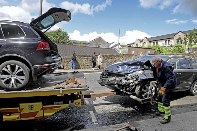Police at the scene as cars are recovered from a crash in Dungannon on Monday 