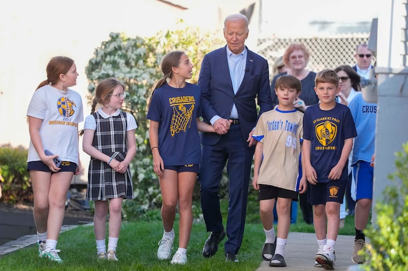 President Joe Biden walks out of his childhood home in Scranton