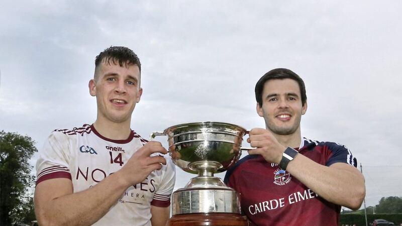 Slaughtneil joint captains Shane McGuigan and Karl McKaigue with the cup after beating Magherafelt during the Derry Senior Football Championship Final at Bellaghy on Sunday. Picture by Margaret McLaughlin 