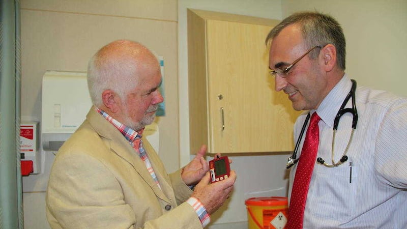 Ballygowan man John Ralph discusses his d-Nav Insulin Guidance Service with Dr Roy Harper, lead diabetes clinician in the South Eastern Health and Social Care Trust 