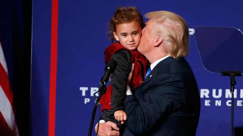 Republican presidential candidate Donald Trump kisses a child from the crowd during a campaign rally in Green Bay, Wisconsin.&nbsp;Picture by Evan Vucci, Associated Press&nbsp;
