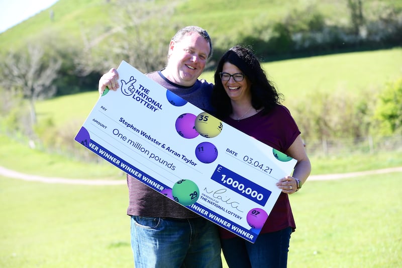 Stephen Webster and partner Arran Taylor plan on taking their children to Disneyland after winning £1 million on the Lotto (The National Lottery/PA).