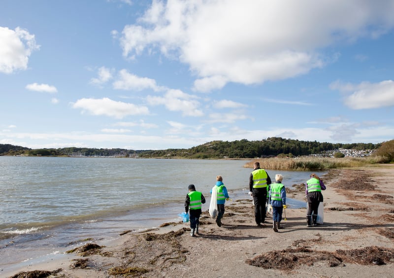 A group of volunteers picking on a beach