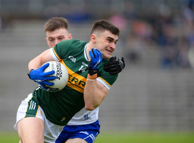 Kerry’s Sean O’Shea holds possesion under pressure from Monaghan’s Ciaran McNulty
