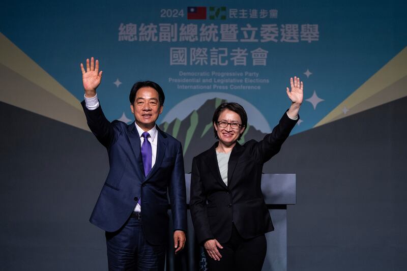 Lai Ching-te celebrates his victory with running mate Bi-khim Hsiao (Louise Delmotte/AP)