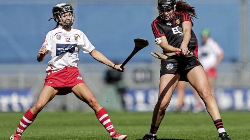 Down&#39;s Sara-Lousie Carr drives forward despite the attentions of Saoirse McCarthy of Cork in the Liberty Insurance All-Ireland Intermediate Camogie Championship Final at Croke Park, Dublin on Sunday Sep 9 2018. Picture: INPHO/Laszlo Geczo. 