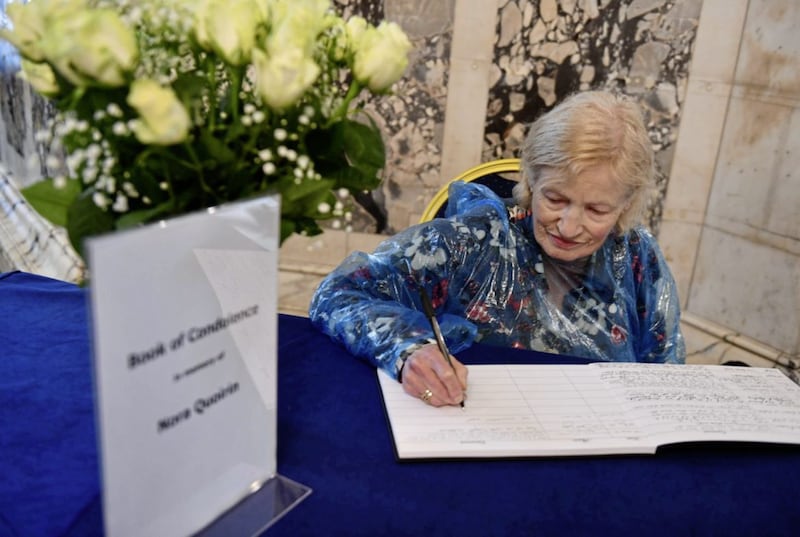Members of the public sign a Book of Condolence at Belfast City Hall in memory of N&oacute;ra Quoirin. Picture by Hugh Russell