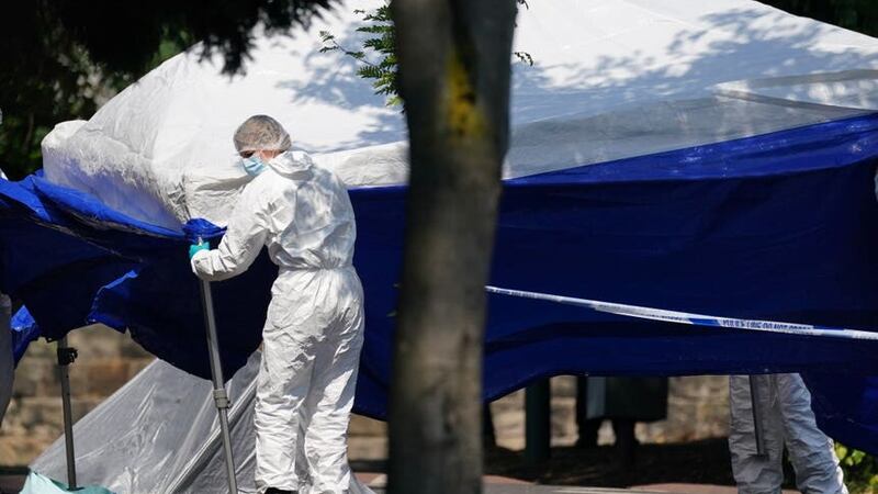 Police forensics officers erect a forensic tent on Magdala Road, Nottingham (Jacob King/PA)