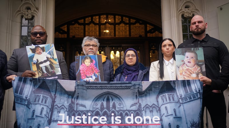 Lanre Haastrup, father of Isaiah Haastrup; Rashid and Aliya Abbasi, the parents of Zainab Abbasi, and Dean Gregory and Claire Staniforth, parents of Indi Gregory, stand outside the Supreme Court