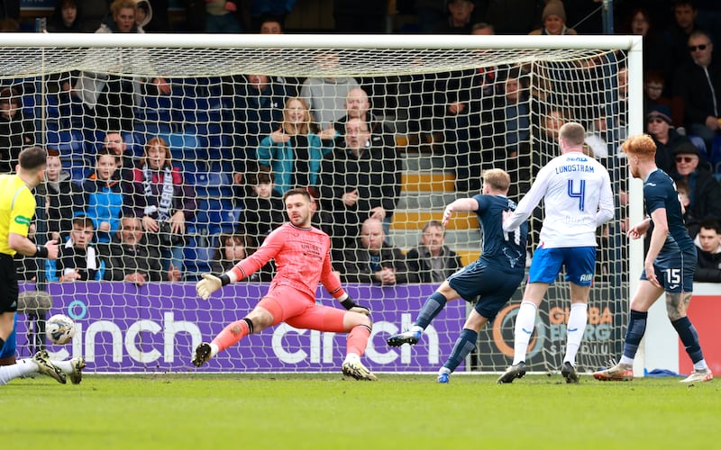 Josh Sims (centre right) scored the third goal for Ross County