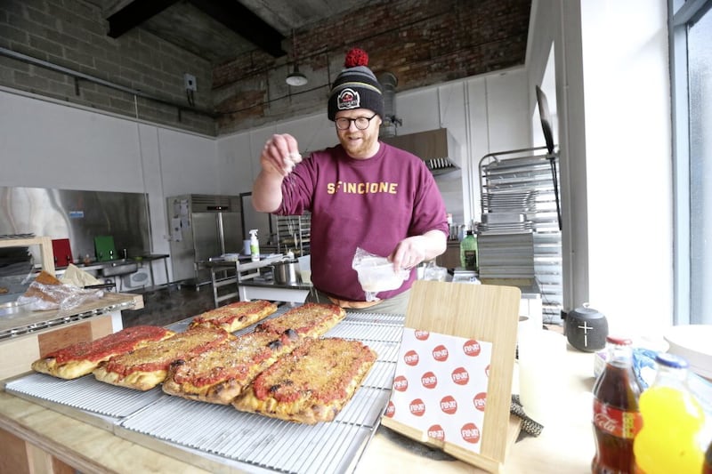 Peter Thompson serves up pizza slices from heaven in east Belfast at Flout! Picture by Hugh Russell 