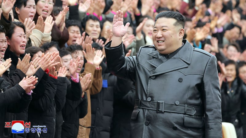 North Korean leader Kim Jong Un waves to the participants of the National Mothers’ Meeting in Pyongyang (Korean Central News Agency/Korea News Service via AP)