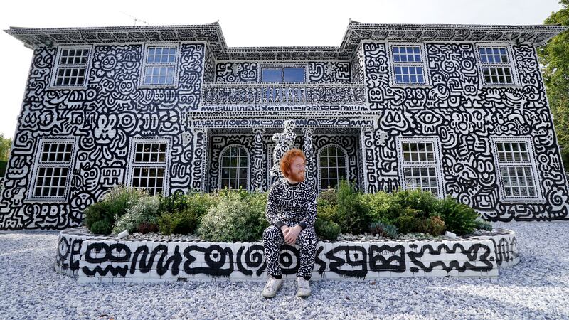 The artist began drawing his monochrome, cartoonish style over every inch of the 12-room house two years ago.