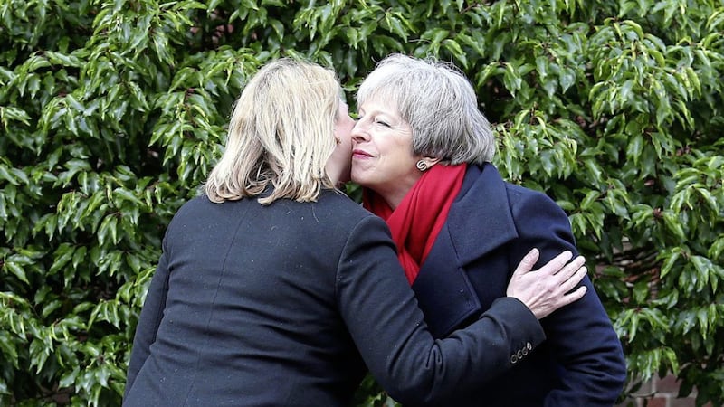 Secretary of State Karen Bradley greets Theresa May as she arrives at Stormont House. Picture by Mal McCann 