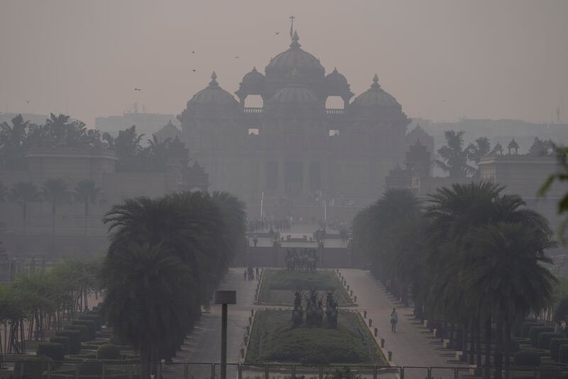 Pollution is a major problem too in India, with thick smog surrounding the Akshardham temple in New Delhi (Altaf Qadri/AP)